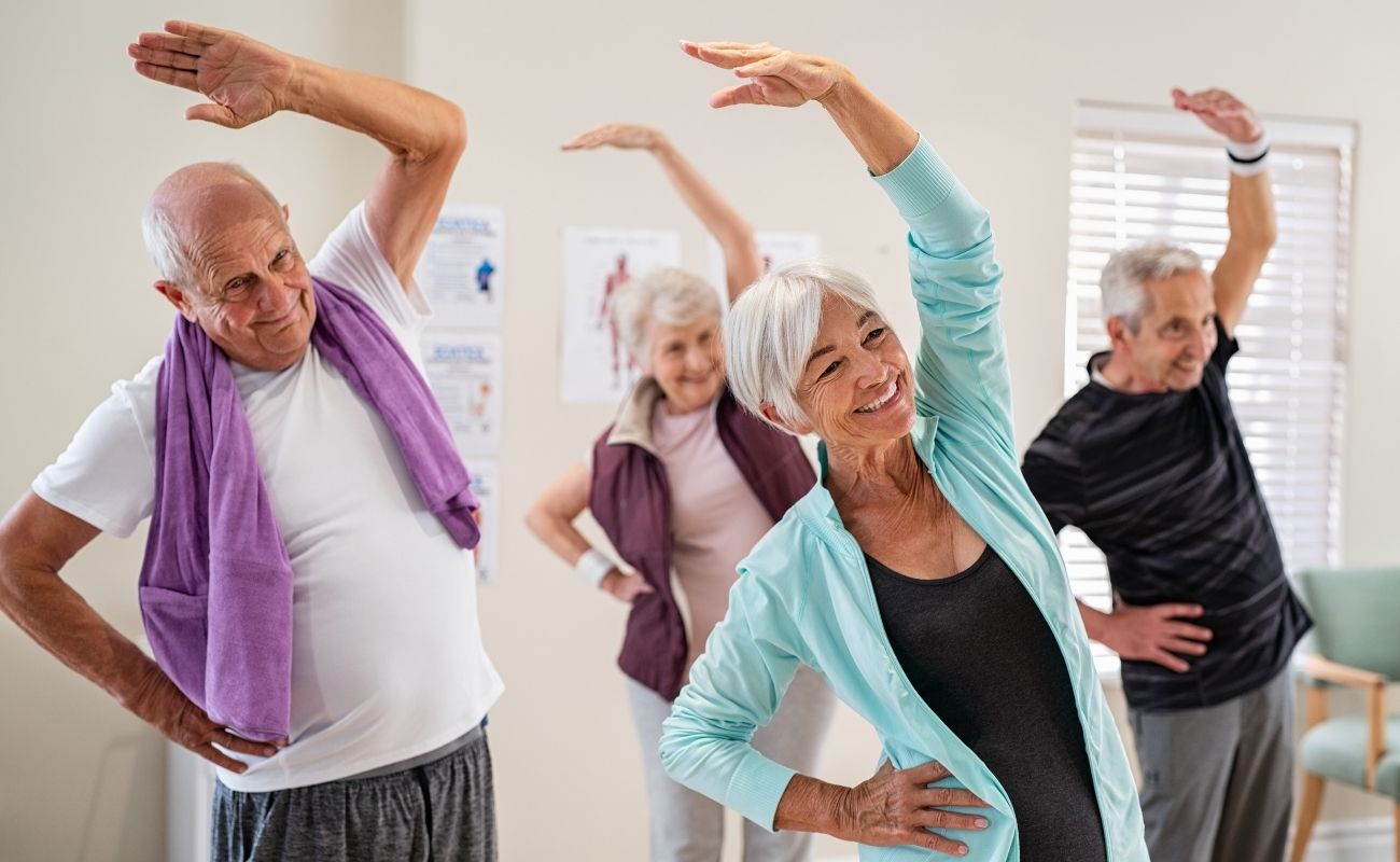 Seniors Stretching at The Gym