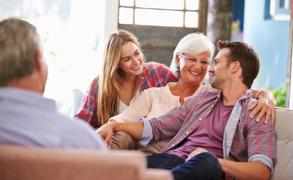 Family with Adult Children Relaxing on Sofa