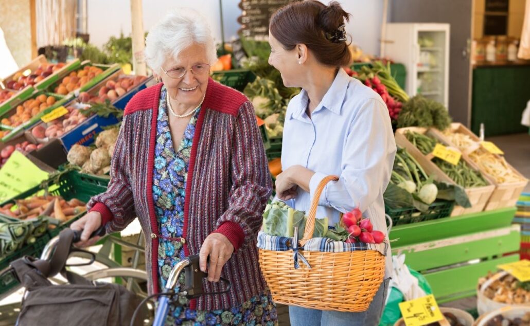 senior woman with caregiver shopping