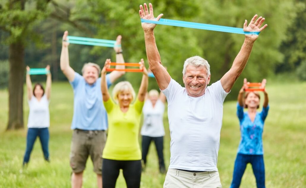 Seniors Exercising with Resistance Bands Outdoors