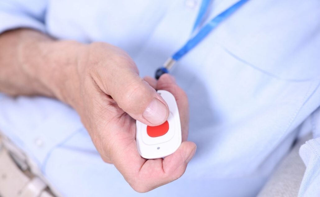 Senior Man Pressing Emergency Call Button